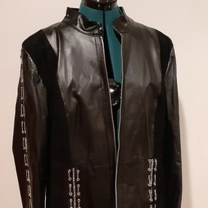 Black, Pamela Mccoy, leather jacket with chains.